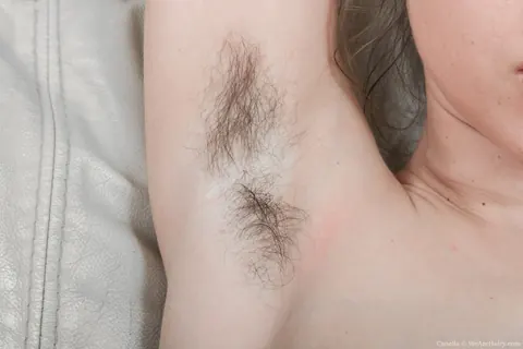 Woman Strips Nude to Finger Her Hairy Bush – photo 14 of 17