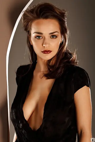 Short-Haired Brunette with Big Natural Tits and a Large Ass Poses in Heels