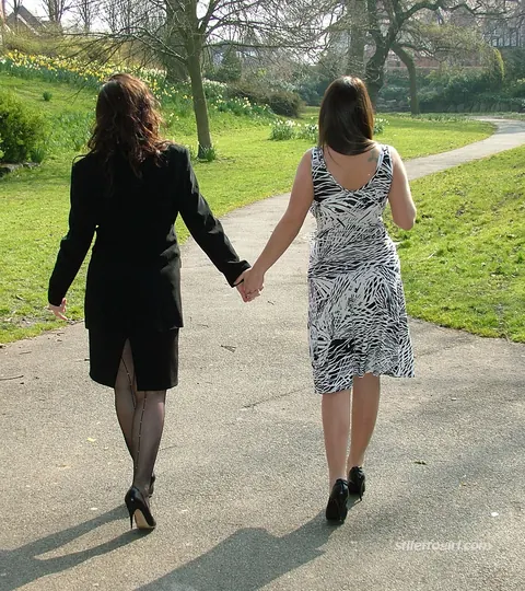 Two Women in Skirts, Stockings and Heels Kiss Outdoors – photo 6 of 16