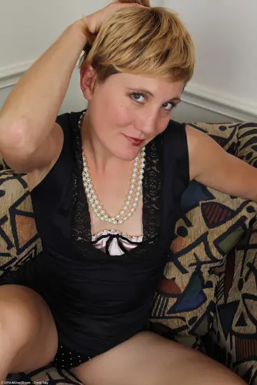 Short-Haired Blonde MILF in a Dress Masturbates with a Dildo and Fingers