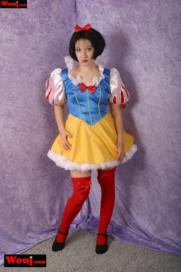 Short-Haired Brunette Poses in Costume and Stockings