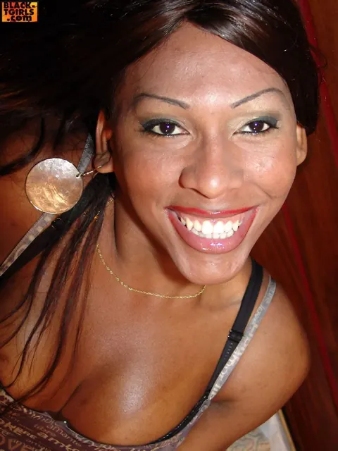 Ebony Trans Woman Disrobes and Poses Nude with Hard Cock – photo 1 of 16