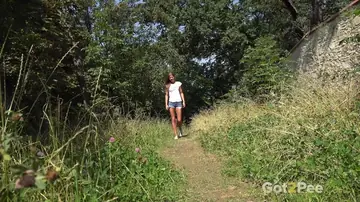 Redhead Yanks Down Her Shorts to Piss Outdoors