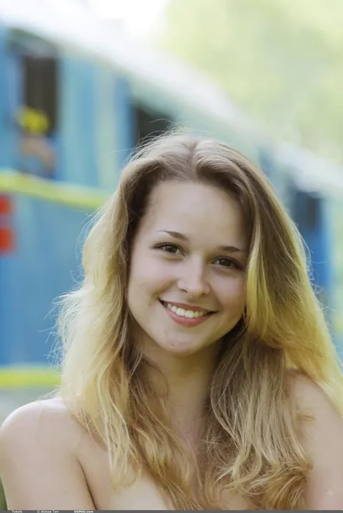 Toxic A: Tanned Blonde Undresses on Railroad Tracks in the Forest – photo 14 of 20