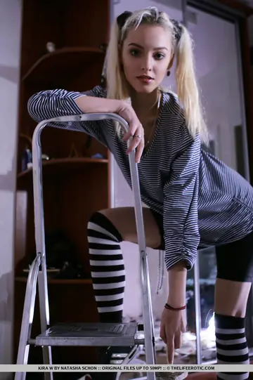 Blonde Strips to Striped Socks and Shows Her Shaved Pussy