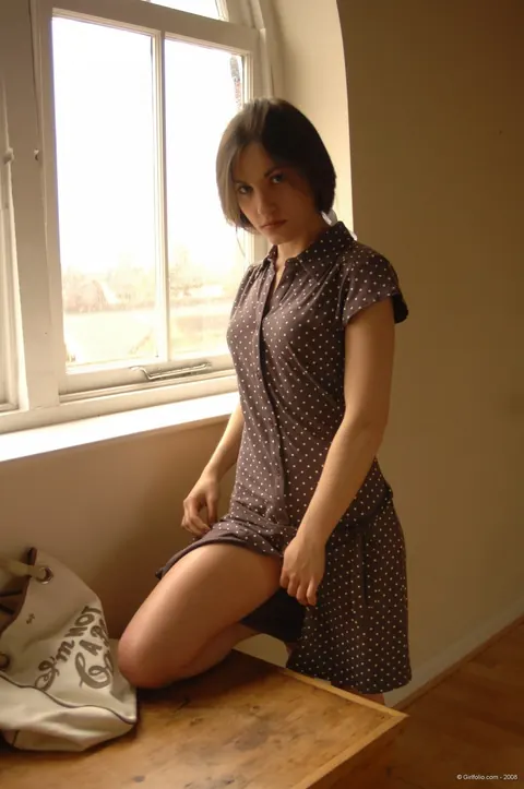 Busty Brunette MILF Strips Out of Her Dress by the Window – photo 2 of 12
