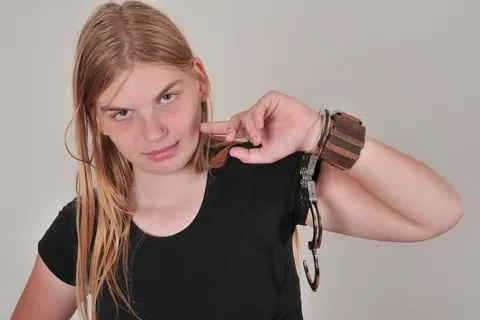 Redhead Amateur Poses in Handcuffs – photo 1 of 16
