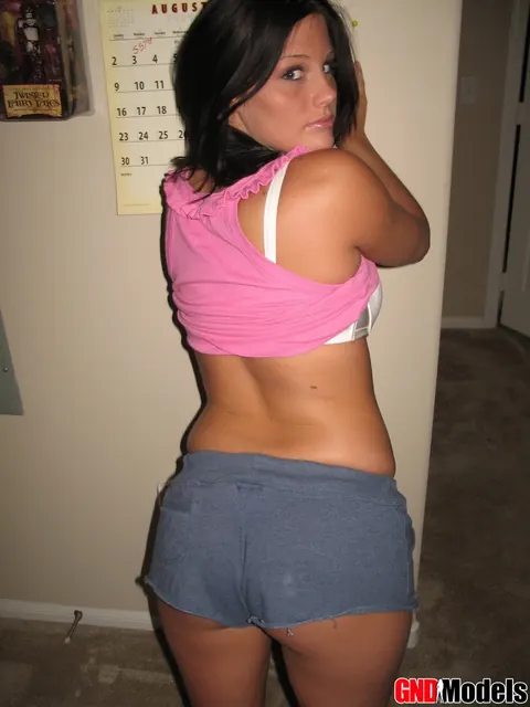 Brunette in Shorts Strips and Spreads Her Shaved Pussy – photo 5 of 12