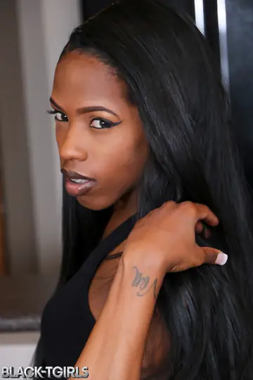 Ebony Trans Woman Undresses and Displays Her Uncut Cock