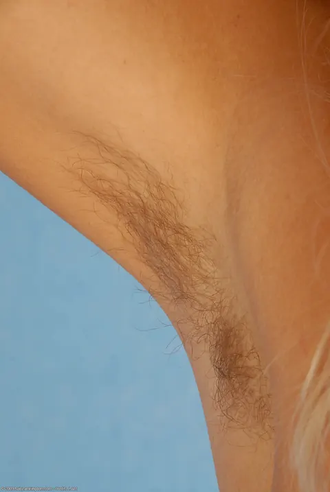 Blonde Pulls Her Panties Aside and Spreads Her Hairy Pussy – photo 19 of 21