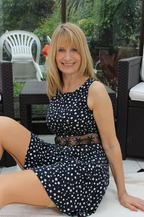 Busty Blonde MILF Strips Out of Her Stockings and Spreads – photo 3 of 20