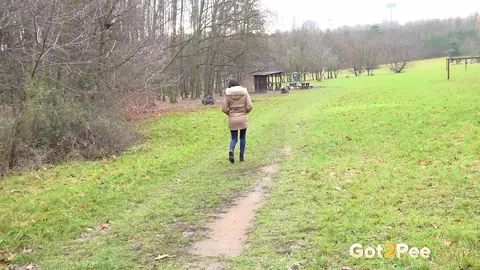Brunette Unbuttons Her Jeans and Pees on a Country Lane – photo 15 of 15