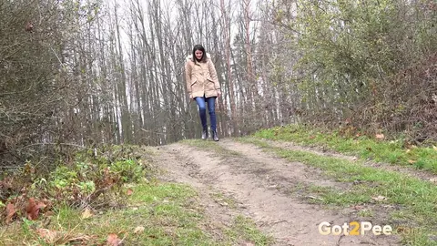 Brunette Unbuttons Her Jeans and Pees on a Country Lane – photo 2 of 15