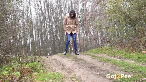 Brunette Unbuttons Her Jeans and Pees on a Country Lane – photo 3 of 15
