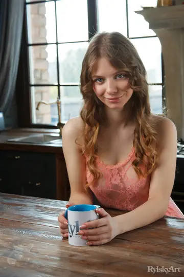 Woman Strips Nude on the Kitchen Table Beside Coffee
