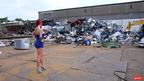 Redhead in a Short Dress and Heels Poses by a Car – photo 10 of 15