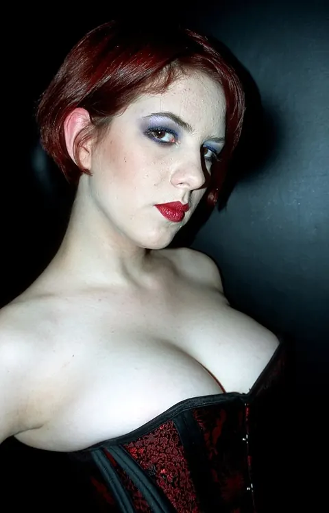 Busty Redhead in a Corset, Heels and Boots Leads Bondage Threesome – photo 18 of 21