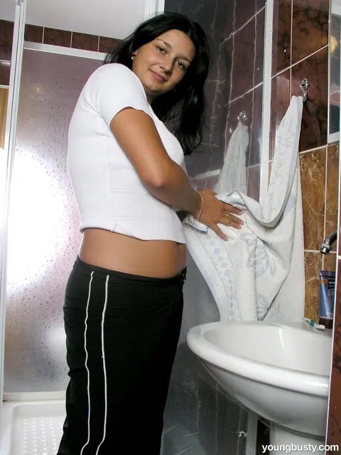 Thick Brunette Strips Out of Her Panties in the Bathroom – photo 1 of 20
