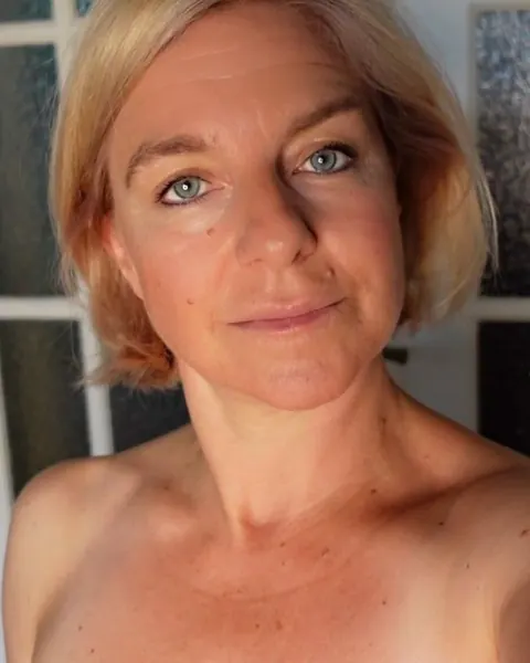 Mature Blonde with Big Tits Poses at the Window – photo 5 of 11
