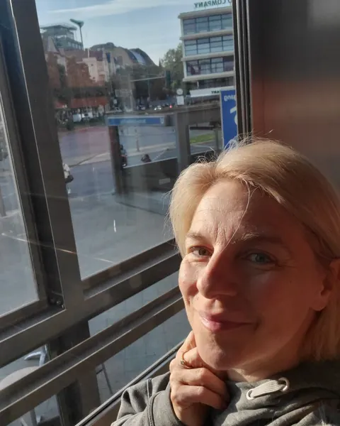 Mature Blonde with Big Tits Poses at the Window – photo 7 of 11