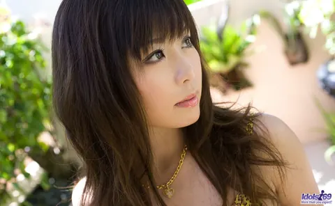 Aya Hirai: Busty Japanese Brunette Strips Out of Her Skirt by the Pool – photo 5 of 16