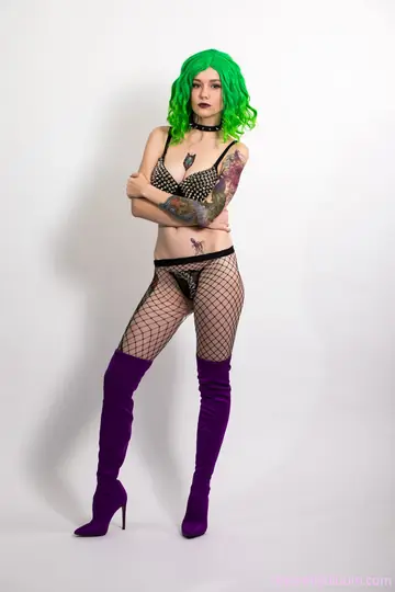 Slim Hairy Babe Spreads Her Pussy in Fishnet Lingerie