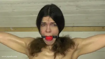 Brunette Twists in Bondage While Gagged and Restrained