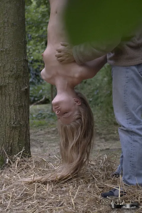 Cayenne Klein: Slim Blonde Hangs Upside Down in the Forest with Hair Pulled – photo 15 of 16
