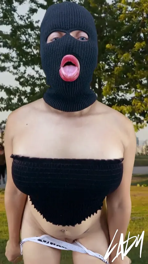 Busty Trans Woman Stands Nude Outdoors and Strokes Her Cock – photo 14 of 15