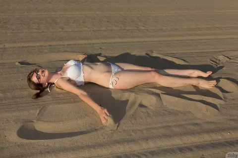 Penny Stiles: Petite Redhead in a Bikini and Glasses Spreads on the Beach – photo 2 of 11
