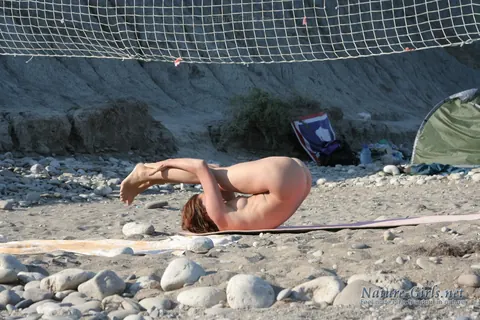 Brunette Strips Nude for Yoga on the Beach While Camping – photo 1 of 16