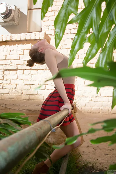 Julie Wheeler: Redhead Strips Out of Her Bodysuit and Skirt Outdoors and Spreads – photo 2 of 11