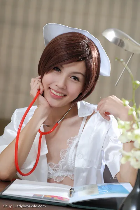 Petite Asian Trans Woman Teases in Fishnet Costume – photo 4 of 17