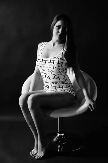 Woman Sheds Her Clothing and Poses Fully Nude
