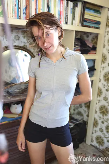 Slim Woman in Shorts Pulls Them Aside to Show Her Hairy Pussy