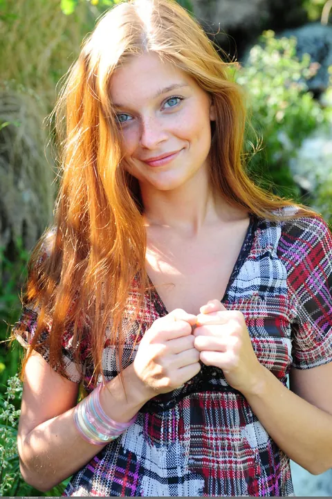 Slim Redhead Undresses on the Beach Near a Waterfall – photo 1 of 20