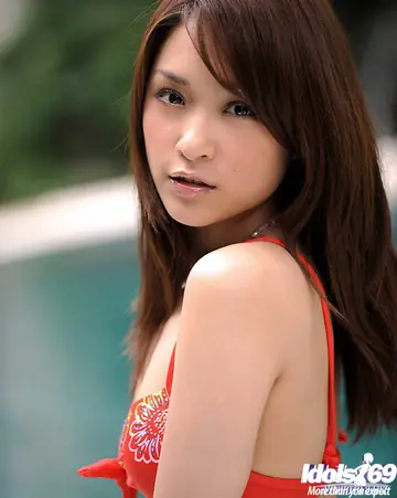 Thick Japanese Brunette Strips Out of Her Bikini by the Pool