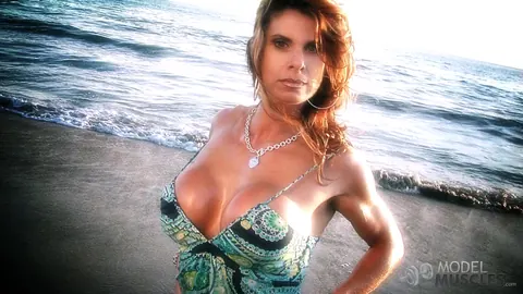 Busty Bodybuilder Flexes Her Muscles and Shows Cleavage on the Beach – photo 8 of 21