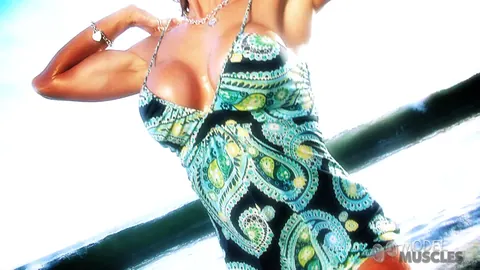 Busty Bodybuilder Flexes Her Muscles and Shows Cleavage on the Beach – photo 2 of 21