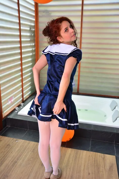 Yenny Contreras: Latina Redhead Flips the Bird and Teases in Uniform Outdoors – photo 10 of 16