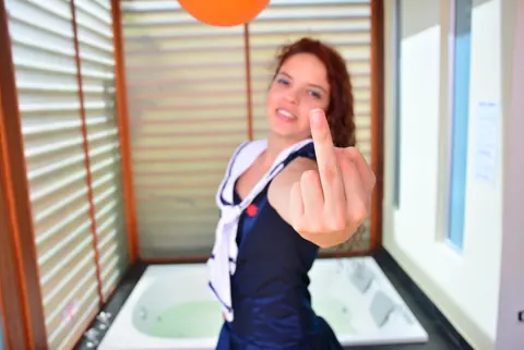 Yenny Contreras: Latina Redhead Flips the Bird and Teases in Uniform Outdoors – photo 6 of 16