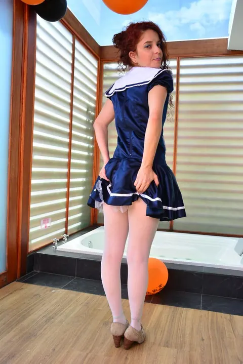 Yenny Contreras: Latina Redhead Flips the Bird and Teases in Uniform Outdoors – photo 14 of 16