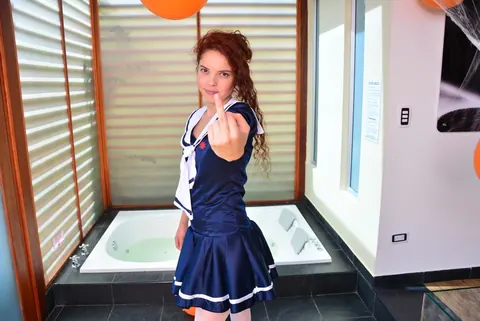 Yenny Contreras: Latina Redhead Flips the Bird and Teases in Uniform Outdoors – photo 5 of 16