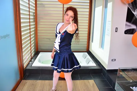 Yenny Contreras: Latina Redhead Flips the Bird and Teases in Uniform Outdoors – photo 7 of 16