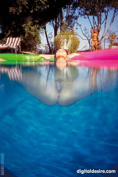 Sunny Leone: Asian Brunette with Enhanced Tits Strips and Poses Nude – photo 18 of 21