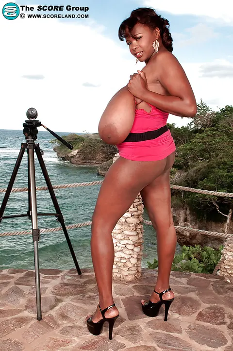 Miosotis: Thick Ebony Brunette Exposes Her Big Natural Tits on the Balcony in Heels – photo 15 of 16