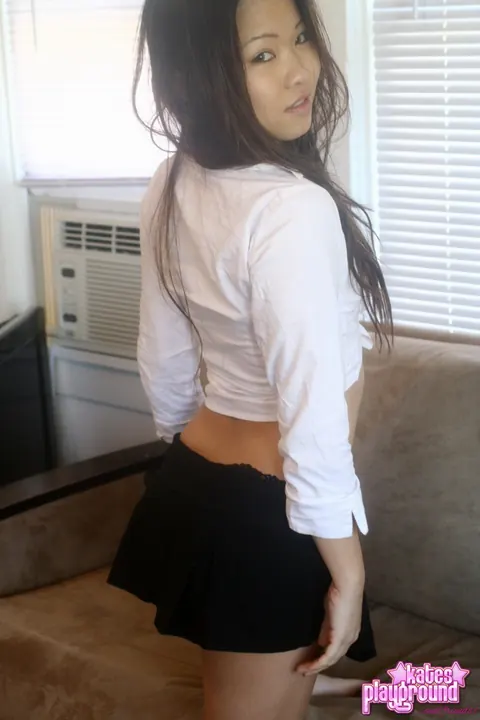 Asian Brunette Teases in a Skirt and Uniform Top – photo 2 of 12