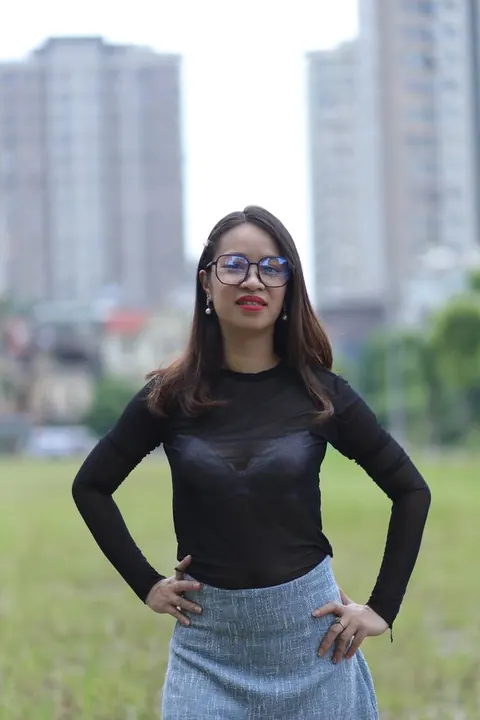Asian Brunette in Glasses Poses Outdoors in Her Outfit – photo 12 of 21