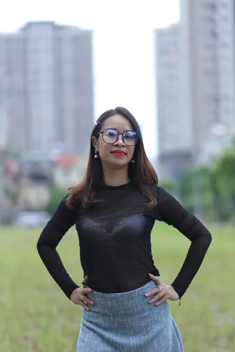Asian Brunette in Glasses Poses Outdoors in Her Outfit – photo 15 of 21