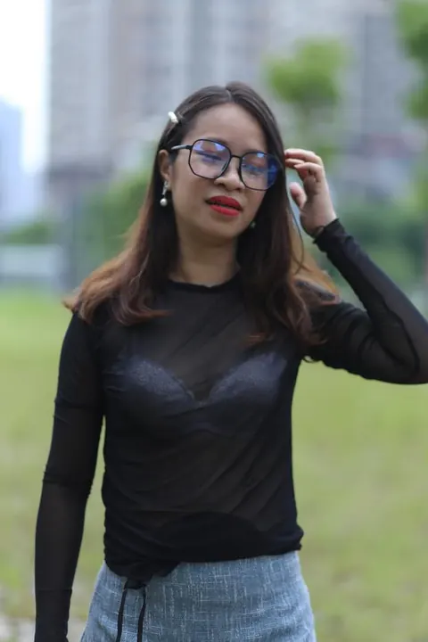 Asian Brunette in Glasses Poses Outdoors in Her Outfit – photo 7 of 21